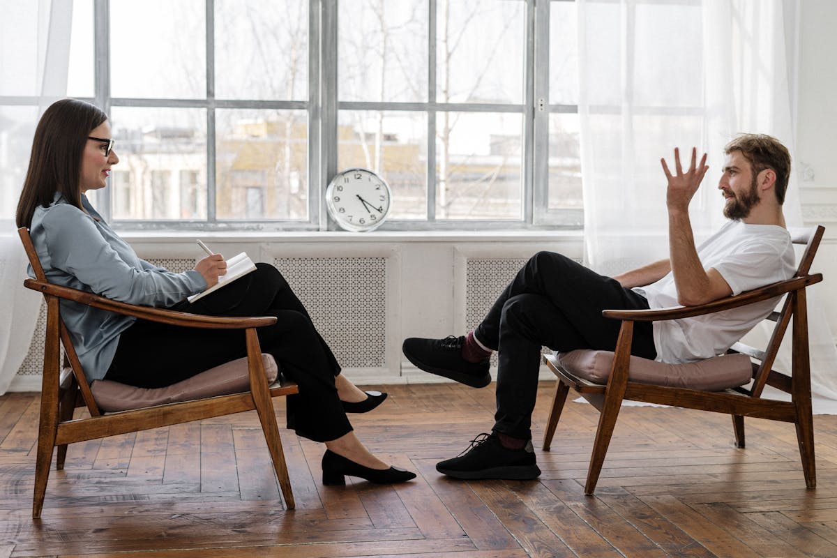 Hypnotherapy session in Derby — therapist and client in a calm, professional setting